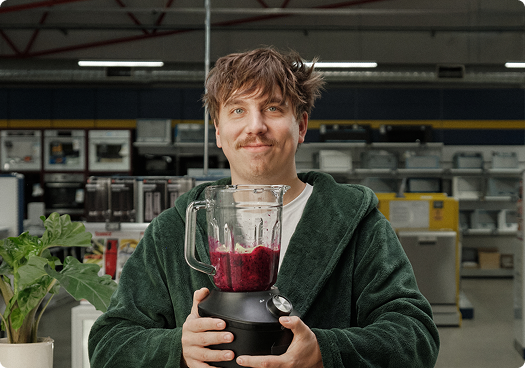 Person holding a blender